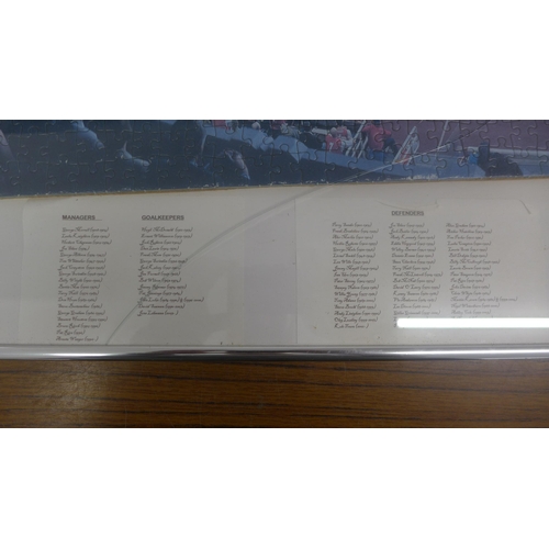 5061 - A framed Arsenal jigsaw puzzle titled 'The Legends of Highbury 1913-2006', broken glass