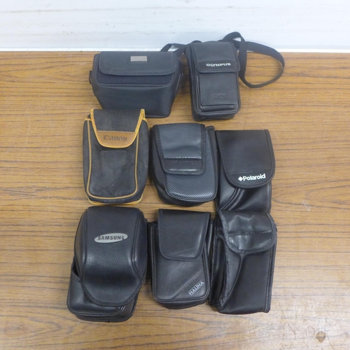 5068 - A collection of vintage camera cases including original Olympus Trip 35 cases, Canon, Samsung, etc,.