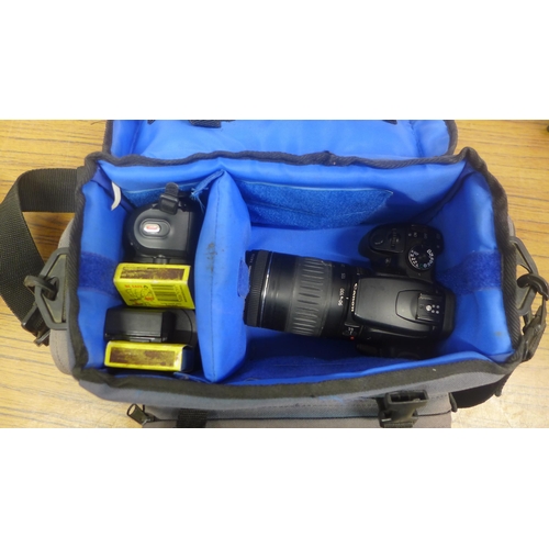 5080 - A Fujifilm Finepix S4400 14 mega pixel camera, boxed and a Canon 400D digital DC, 8.1V camera in bag... 