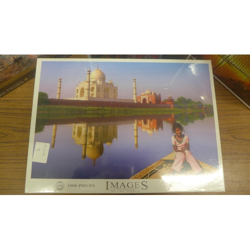 5092 - Four assorted 1000 piece jigsaw puzzles including stone castle, Taj Mahal, Monet Soleil Levante and ... 