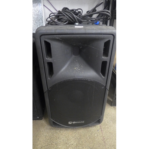 5113 - A pair of QTX sound 450 watt speakers with tripods and a pair of Pro-sound 10 speakers and a speaker... 