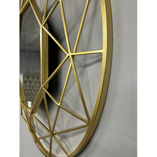3048 - A gold effect circular mirror