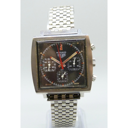 7153 - A Tag Heuer Monaco automatic steel cased chronograph wristwatch with square black dial, on an origin...