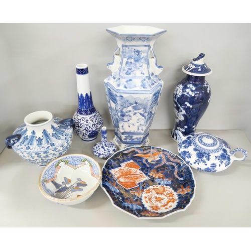 2185 - A collection of mixed oriental blue and white pottery to include vase, teapot, bowl and plate.