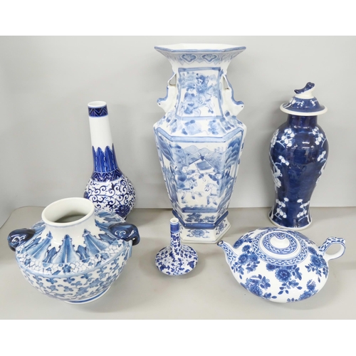 2185 - A collection of mixed oriental blue and white pottery to include vase, teapot, bowl and plate.