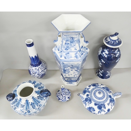 2185 - A collection of mixed oriental blue and white pottery to include vase, teapot, bowl and plate.