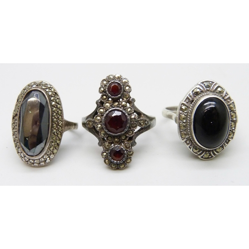 Three silver rings including an .835 example, two lacking some stones ...