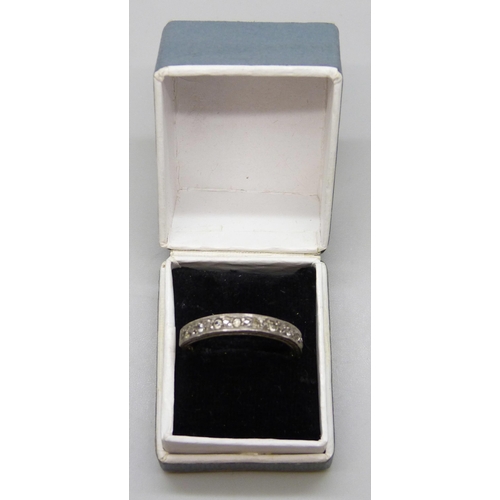 7015 - A 9ct gold and silver half eternity ring