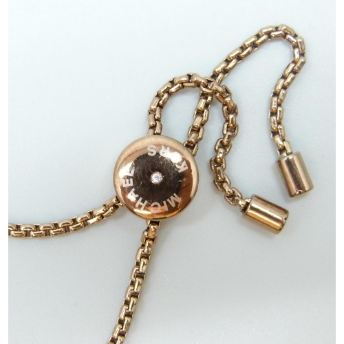 7035 - Franklin mint gold plated gents bracelet and a Michael Kors bracelet