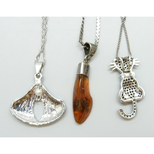 7037 - Two silver cat pendants and chains, a silver and amber pendant and an enamel Art Nouveau style penda... 