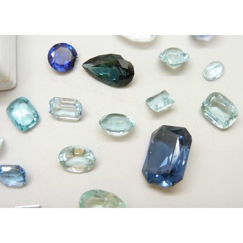 7046 - A quantity of loose blue gemstones including sapphire