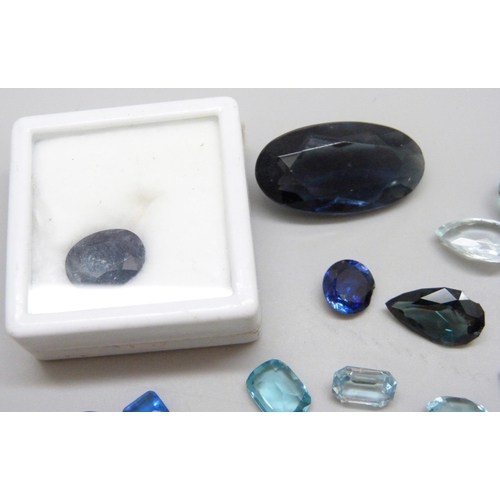 7046 - A quantity of loose blue gemstones including sapphire