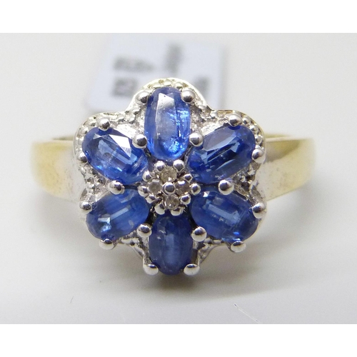7058 - A silver gilt, tanzanite and diamond cluster ring, S