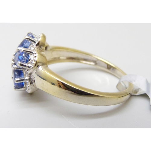7058 - A silver gilt, tanzanite and diamond cluster ring, S