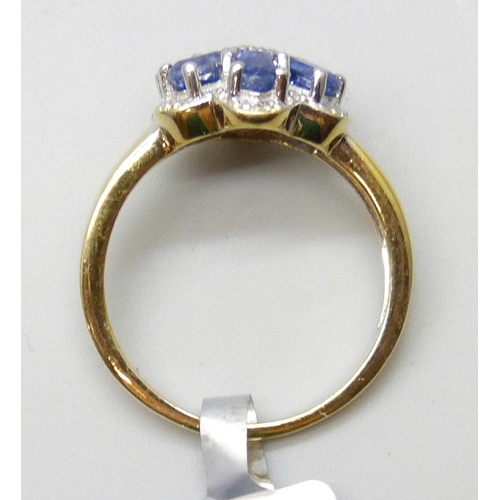 7058 - A silver gilt, tanzanite and diamond cluster ring, S
