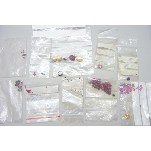 7085 - A collection of costume jewellery, a Dupont pen case and assorted loose gemstones including ruby etc... 