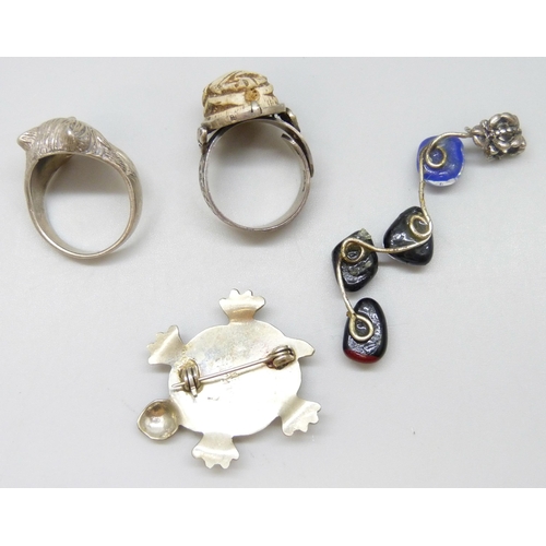 7096 - A silver cat ring, a Mexican abalone tortoise brooch, an Egyptian scarab ring and a dichroic glass p... 