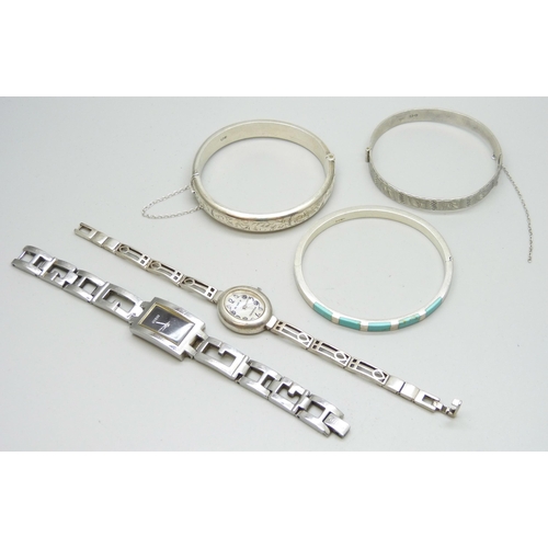 7109 - Three silver bangles, a silver McIntosh wristwatch and other Guess watch