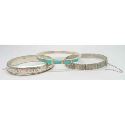 7109 - Three silver bangles, a silver McIntosh wristwatch and other Guess watch
