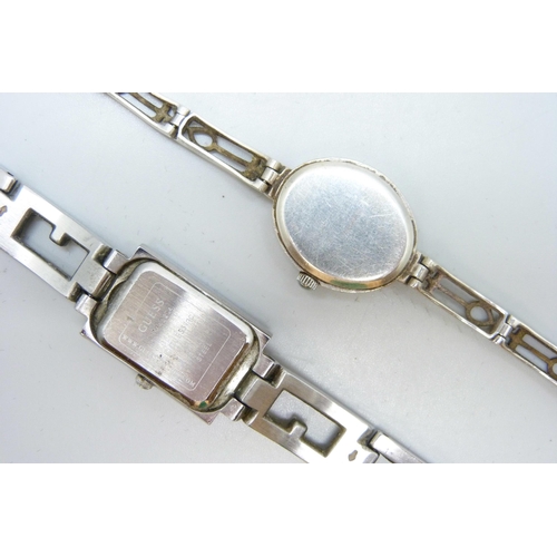 7109 - Three silver bangles, a silver McIntosh wristwatch and other Guess watch