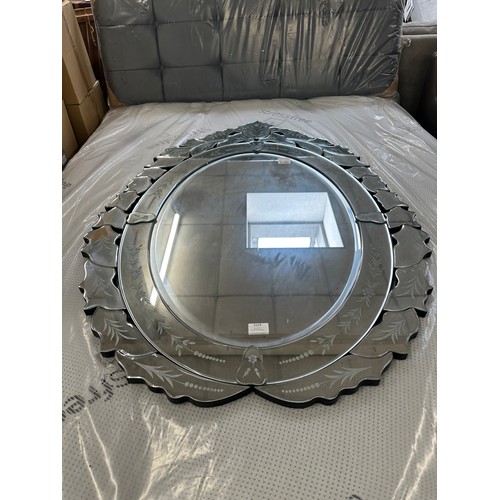 3019 - A Venetian style floral patterned oval mirror