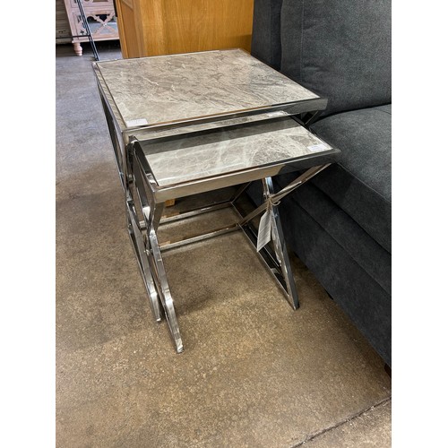 3046 - A Vanquish nest of two tables with chrome base *This lot is subject to VAT