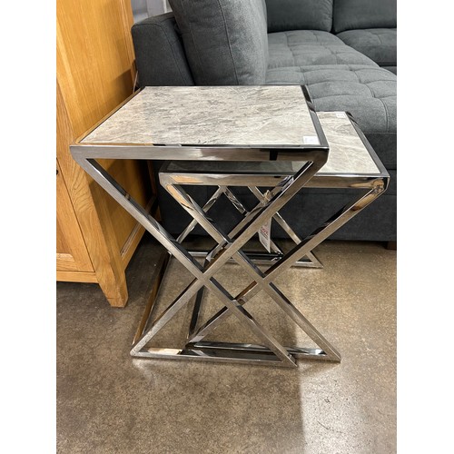 3046 - A Vanquish nest of two tables with chrome base *This lot is subject to VAT