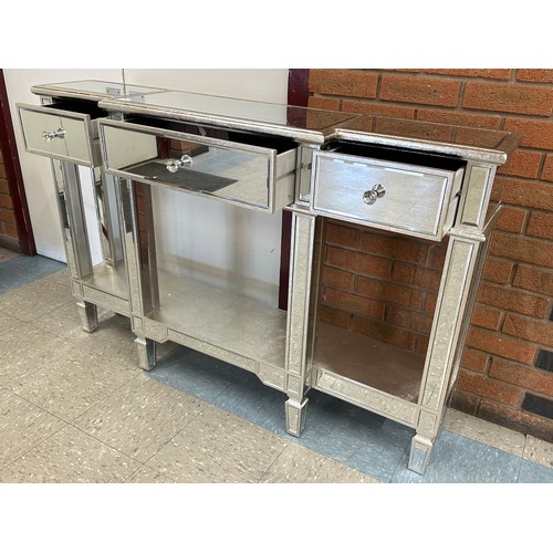 3053 - A silver mirrored 3 drawer console table