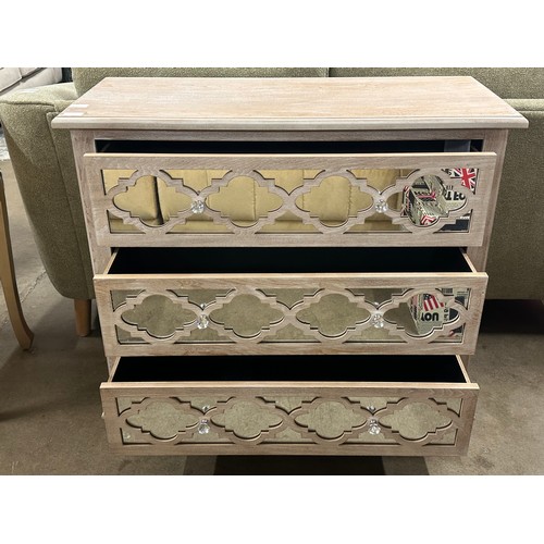 3057 - A Moorish style lattice mirrored chest of 3 drawers