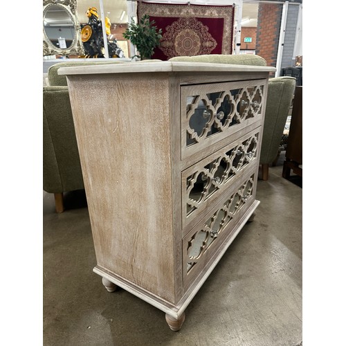 3057 - A Moorish style lattice mirrored chest of 3 drawers