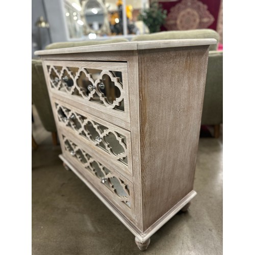 3057 - A Moorish style lattice mirrored chest of 3 drawers