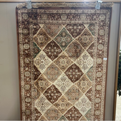 3059 - A multi coloured ground cashmere rug with all over design, 2m x 1m