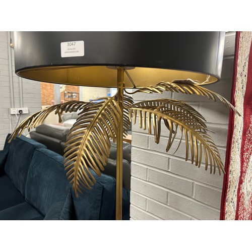 3068 - A black and gold effect leaf floor lamp