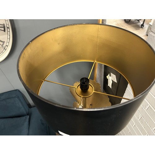3094 - A gold and black leaf floor lamp