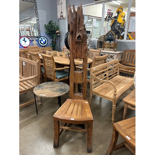 3179 - A rustic tree trunk chair