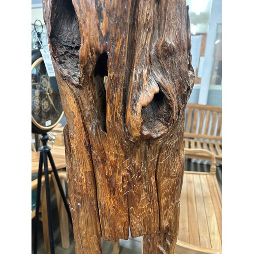 3179 - A rustic tree trunk chair