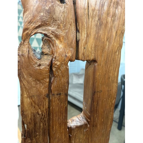 3180 - A rustic tree trunk chair