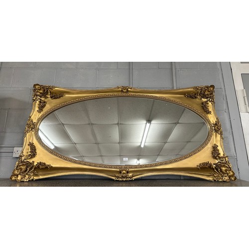 3187 - A gilt effect carved framed antique style mirror