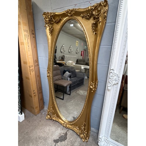 3187 - A gilt effect carved framed antique style mirror