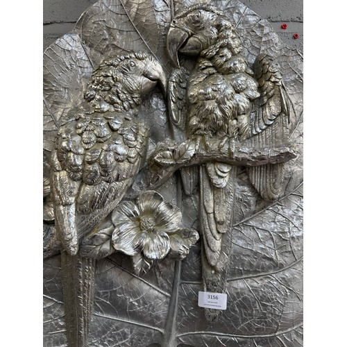 3204 - A silver painted parrot wall plaque