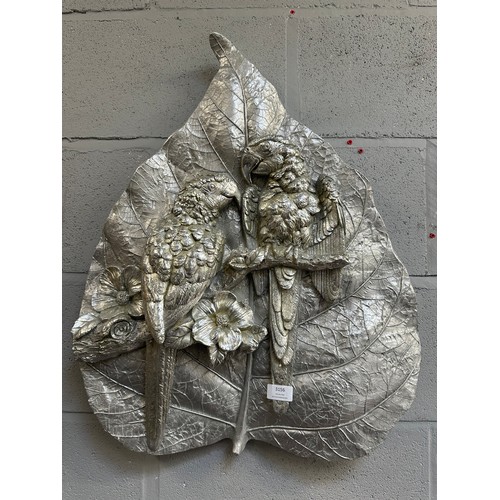 3206 - A silver painted parrot wall plaque