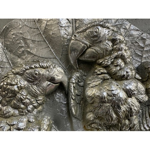 3206 - A silver painted parrot wall plaque
