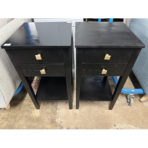 3209 - A pair of black two drawer bedside tables