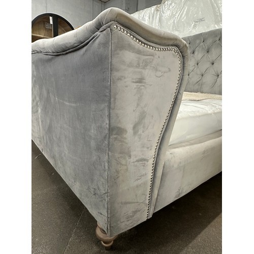 3230 - A grey velvet buttoned double bedframe
