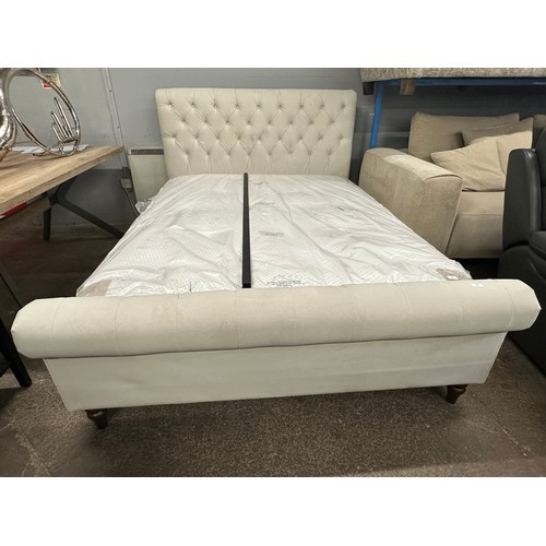 3201 - A champagne velvet button back king size bed frame