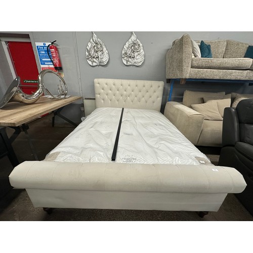 3201 - A champagne velvet button back king size bed frame