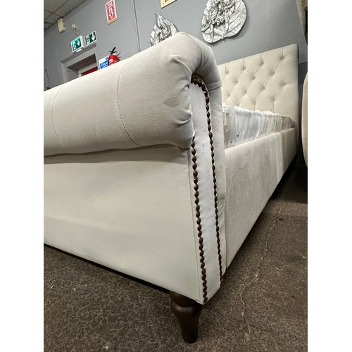 3201 - A champagne velvet button back king size bed frame