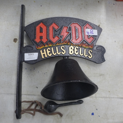 5063 - A cast metal AC/DC Hells bells wall mountable bell  *This lot is subject to VAT