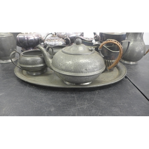 5069 - A quantity of assorted metal tea ware including tea pots, milk jugs and a serving tray