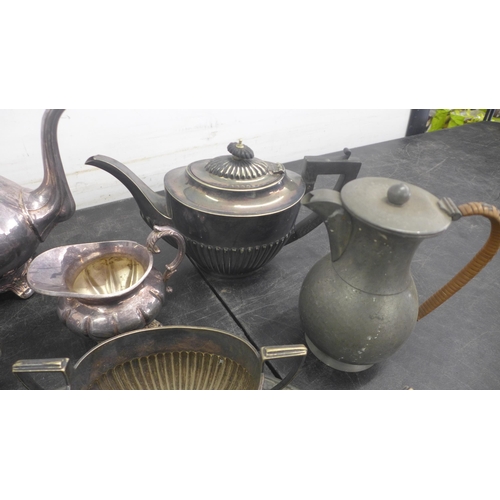 5069 - A quantity of assorted metal tea ware including tea pots, milk jugs and a serving tray